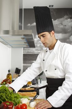 Chef getting some lettuce for his salad.