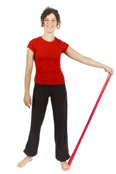 Young woman doing some exercise with an elastic ribbon.