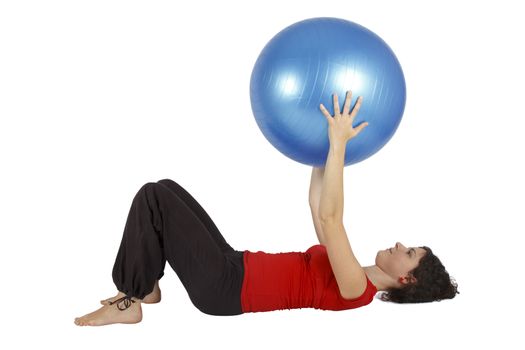 Young woman holding a blue yoga ball.