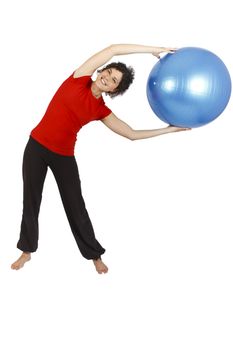 Young woman doing some exercise with a blue yoga ball.