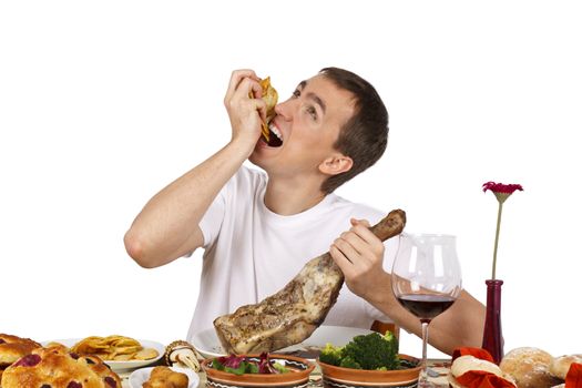 Bad mannered young man eating french fries. Isolated of white background.