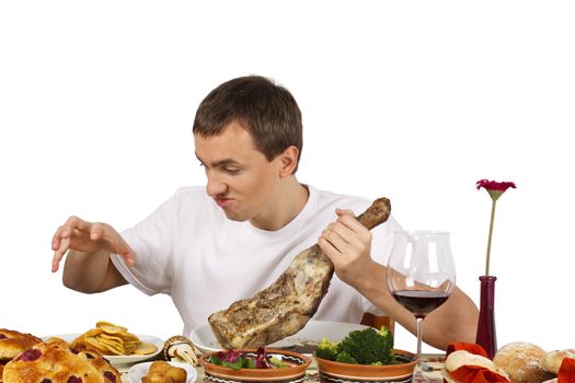 Young man about to catch some french fries. Isolated of white background.