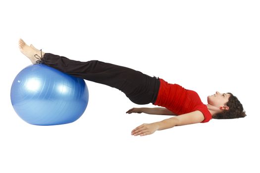 Young woman doing some sit-ups with a blue yoga ball.