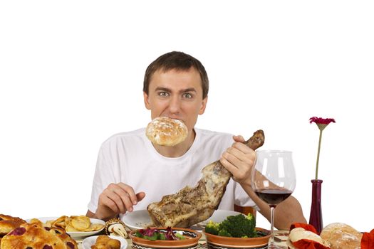 Young man with a bread in his mouth. Isolated of white background.