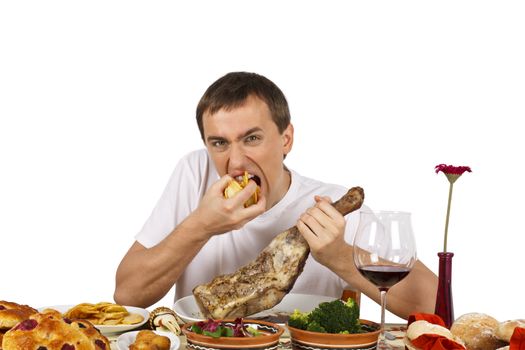 Bad mannered young man eating french fries. Isolated of white background.