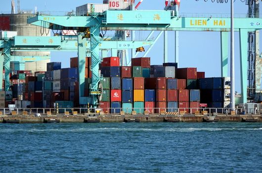 KAOHSIUNG, TAIWAN -- AUGUST 13 , 2017: Shipping containers are ready to be loaded onto ships at Kaohsiung container port.