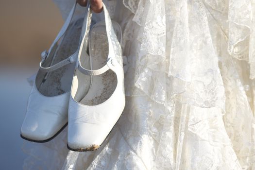 Detail of shoes and wedding dress