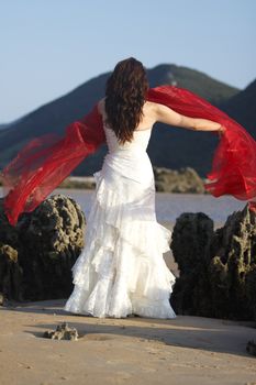 Bride with red ribbon.