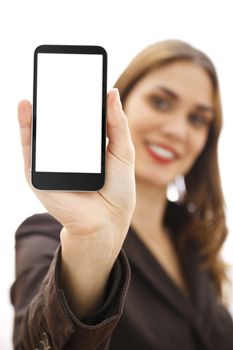 Businesswoman out of focus at background showing a mobile phone with white display. Isolated on white background.