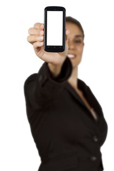 Businesswoman out of focus at background showing a mobile phone with white display. Isolated on white background.