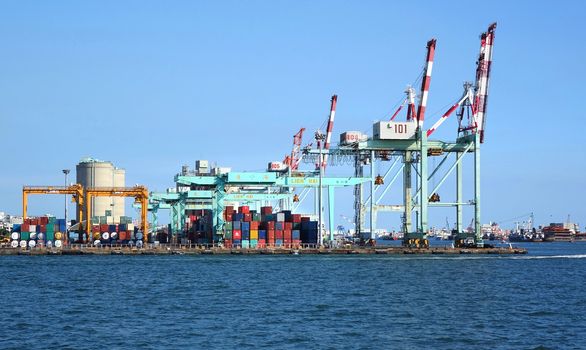 KAOHSIUNG, TAIWAN -- AUGUST 13 , 2017: Shipping containers are ready to be loaded onto ships at Kaohsiung container port.
