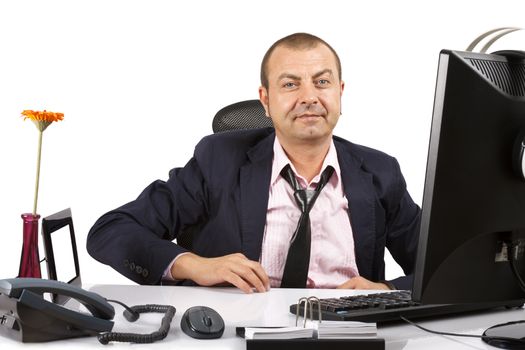 Businessman in front of computer. Over white.