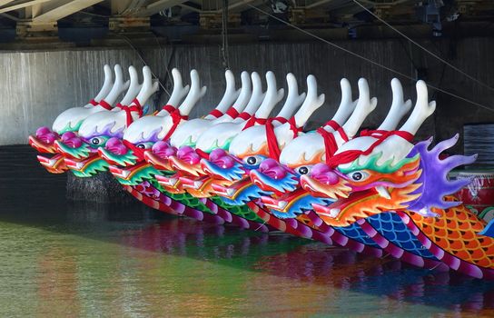 KAOHSIUNG, TAIWAN -- JUNE 7, 2019: Decorated dragon boats are anchored on the Love River in Kaohsiung in preparation for the Dragon Boat Festival