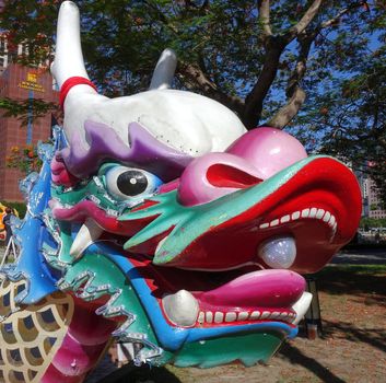 KAOHSIUNG, TAIWAN -- MAY 27, 2016: The dragon shaped figurehead of a traditional dragon boat is being prepared for the upcoming Dragon Boat Festival.
