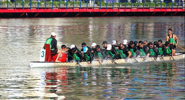 KAOHSIUNG, TAIWAN -- MAY 21, 2017: The China Post team trains on the Love River in preparation for the upcoming Dragon Boat Festival.
