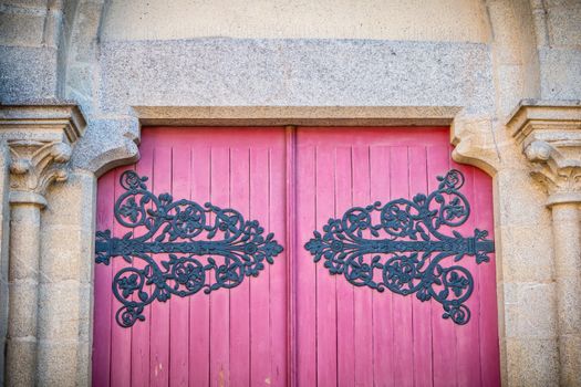 detail of the wooden door of Saint Jean-Baptiste Church in Montaigu, France