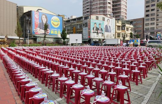 KAOHSIUNG, TAIWAN -- OCTOBER 19, 2018: Stools, water and fans are prepared for a rally for city council candidate Huang Xiangshu of the KMT in the run up for the November 24 elections.