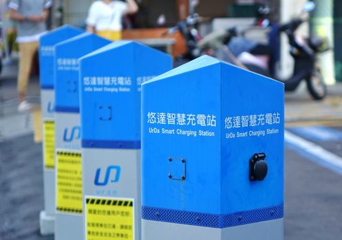 KAOHSIUNG, TAIWAN -- JULY 29, 2018: A row of electric charging stations designed for electric vehicles that use clean energy.
