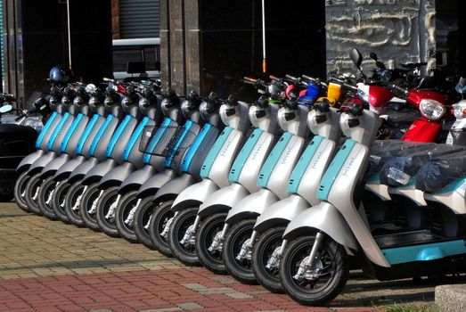 KAOHSIUNG, TAIWAN -- MAY 12, 2018: To phase out gasoline scooters the switch to electric scooters is encouraged. Here is a line up of brand new electric scooters for sale.