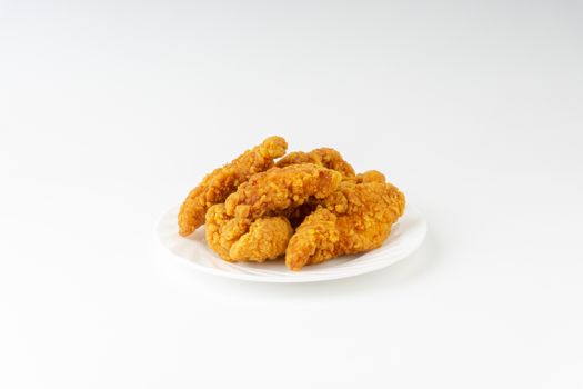 Fried breaded chicken fillet isolated on white background 