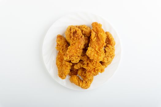 Fried breaded chicken fillet isolated on white background 