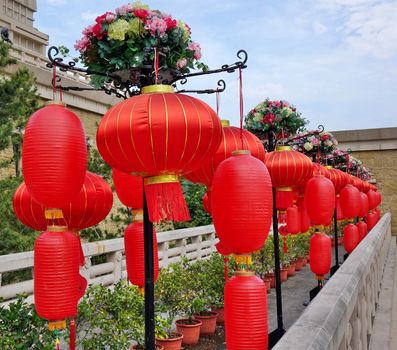 KAOHSIUNG, TAIWAN -- JANUARY 25, 2020: To celebrate the Chinese Year the Fo Guang Shan Buddhist complex is decorated with red lanterns and flowers. 