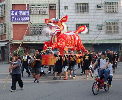 KAOHSIUNG, TAIWAN -- OCTOBER 15, 2016: The religious procession with the Fire Lion effigy is an integral feature of the yearly Wannian Folk Festival.