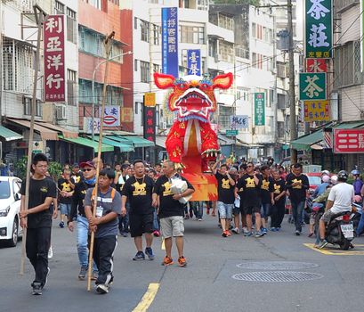 KAOHSIUNG, TAIWAN -- OCTOBER 15, 2016: The religious procession with the Fire Lion effigy is an integral feature of the yearly Wannian Folk Festival.