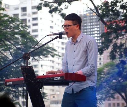 KAOHSIUNG, TAIWAN - JUNE 23: Local pop group Fleabags entertains visitors to the 2012 Dragon Boat Festival along the Love River on June 23, 2012 in Kaohsiung