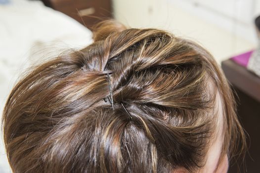 Closeup detail of a woman at hairdresser showing hair style