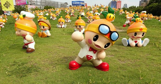 KAOHSIUNG, TAIWAN -- JUNE 28, 2014: These cute fruit wizards have been set up in a public park by the agricultural bureau to promote the sale of local farm products.