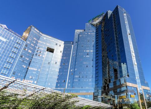 ALMATY, KAZAKHSTAN - MAY 14, 2017: Panoramic view of Business Center Nurly Tau. Made in the style of Hi-Tech, repeating silhouettes of mountains Zailisky Alatau. Construction company - Basis A.

Almaty, Kazakhstan - May 14, 2017: Panoramic view of Business Center Nurly Tau in Almaty, Kazakhstan. Made in the style of Hi-Tech, repeating silhouettes of mountains Zailisky Alatau. Construction company - Basis A.