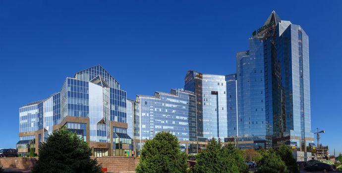 ALMATY, KAZAKHSTAN - MAY 14, 2017: Panoramic view of Business Center Nurly Tau in Almaty, Kazakhstan. Made in the style of Hi-Tech, repeating silhouettes of mountains Zailisky Alatau. Construction company - Basis A.

Almaty, Kazakhstan - May 14, 2017: Panoramic view of Business Center Nurly Tau in Almaty, Kazakhstan. Made in the style of Hi-Tech, repeating silhouettes of mountains Zailisky Alatau. Construction company - Basis A.