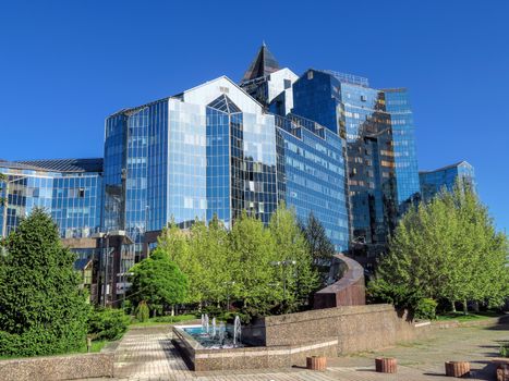 ALMATY, KAZAKHSTAN - MAY 14, 2017: Business Center Nurly Tau in Almaty, Kazakhstan. Made in the style of Hi-Tech, repeating silhouettes of mountains Zailisky Alatau. Construction company - Basis A.

Almaty, Kazakhstan - May 14, 2017: Business Center Nurly Tau in Almaty, Kazakhstan. Made in the style of Hi-Tech, repeating silhouettes of mountains Zailisky Alatau. Construction company - Basis A.