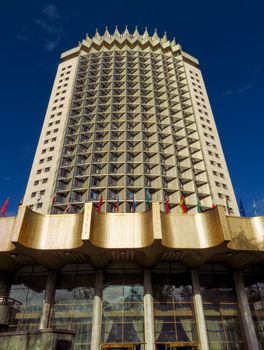 ALMATY, KAZAKHSTAN - MAY 7, 2017: Hotel "Kazakhstan". It is a famous historical monument in center of Almaty city. Built in 1977.

Almaty, Kazakhstan - May 7, 2017: Hotel "Kazakhstan". It is a famous historical monument in center of Almaty city. Built in 1977.