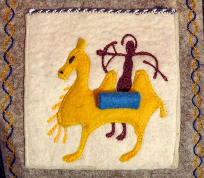 ALMATY, KAZAKHSTAN - MARCH 26, 2017: Traditional souvenirs - Kazakh ethnic small carpet in street market in Almaty, Kazakhstan

Almaty, Kazakhstan - March 26, 2017: Traditional souvenirs - Kazakh ethnic small carpet in street market in Almaty, Kazakhstan