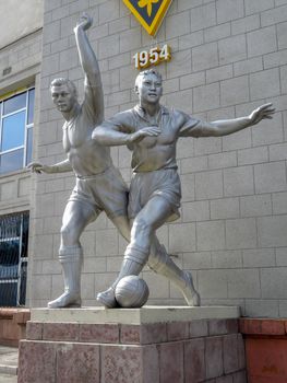 ALMATY, KAZAKHSTAN - MAY 21, 2017: Old sculpture of football players located near The Central Stadium of Almaty city, Kazakhstan.

Almaty, Kazakhstan - May 21, 2017: Old sculpture of football players located near The Central Stadium of Almaty city, Kazakhstan.