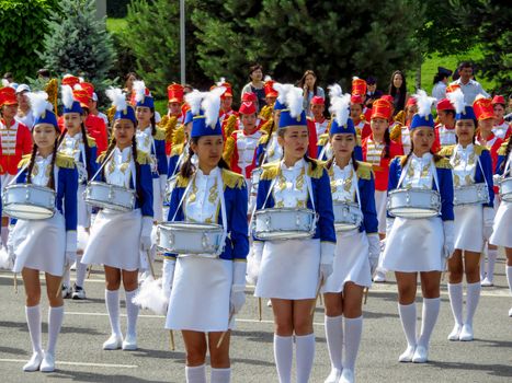 ALMATY, KAZAKHSTAN - JUNE 1, 2017: Solemn parade of children's and youth musical orchestras and ensembles on the Republic Square. More than 5,000 schoolchildren of the megapolis took part in the parade.

Almaty, Kazakhstan - June 1, 2017: Solemn parade of children's and youth musical orchestras and ensembles on the Republic Square. More than 5,000 schoolchildren of the megapolis took part in the parade.