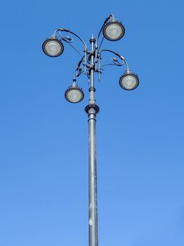 Street lamp with national kazakh ornament over blue sky