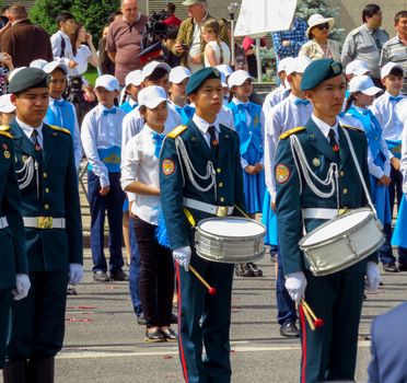 ALMATY, KAZAKHSTAN - JUNE 1, 2017: Solemn parade of children's and youth musical orchestras and ensembles on the Republic Square. More than 5,000 schoolchildren took part in the parade.

Almaty, Kazakhstan - June 1, 2017: Solemn parade of children's and youth musical orchestras and ensembles on the Republic Square. More than 5,000 schoolchildren of the megapolis took part in the parade.