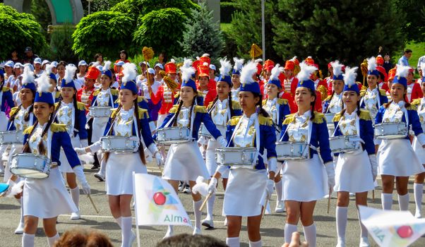ALMATY, KAZAKHSTAN - JUNE 1, 2017: Solemn parade of children's and youth musical orchestras and ensembles on the Republic Square. More than 5,000 schoolchildren took part in the parade.

Almaty, Kazakhstan - June 1, 2017: Solemn parade of children's and youth musical orchestras and ensembles on the Republic Square. More than 5,000 schoolchildren of the megapolis took part in the parade.
