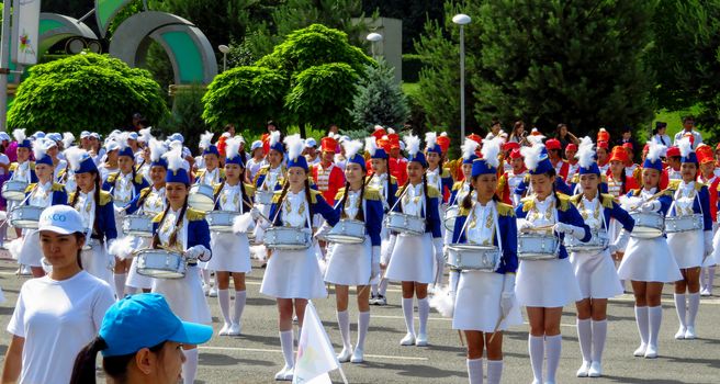 ALMATY, KAZAKHSTAN - JUNE 1, 2017: Solemn parade of children's and youth musical orchestras and ensembles on the Republic Square. More than 5,000 schoolchildren of the megapolis took part in the parade.

Almaty, Kazakhstan - June 1, 2017: Solemn parade of children's and youth musical orchestras and ensembles on the Republic Square. More than 5,000 schoolchildren of the megapolis took part in the parade.