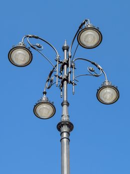 Street lamp with national ornament over blue sky Almaty, Kazakhstan