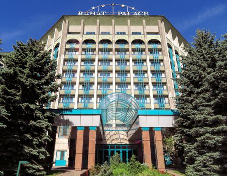 ALMATY, KAZAKHSTAN - MAY 21, 2017: The Rahat Palace Hotel is located at the intersection of Satpayev and Baizakov streets in Almaty, Kazakhstan

Almaty, Kazakhstan - May 21, 2017: The Rahat Palace Hotel is located at the intersection of Satpayev and Baizakov streets in Almaty, Kazakhstan