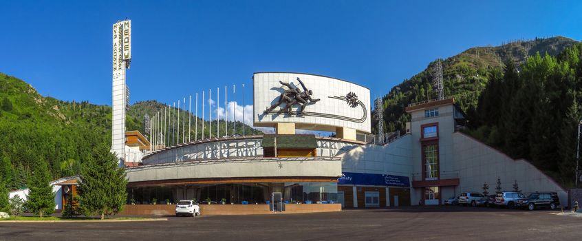 Almaty, Kazakhstan - July 21, 2017: Panoramic view of famous skating rink Medeo and mountains at the background in Almaty, Kazakhstan