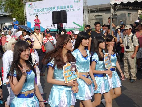 KAOHSIUNG, TAIWAN -- OCTOBER 1, 2017: Young girls dressed up as comic book characters join the parade at the opening of the 2017 Ecomobility Festival.