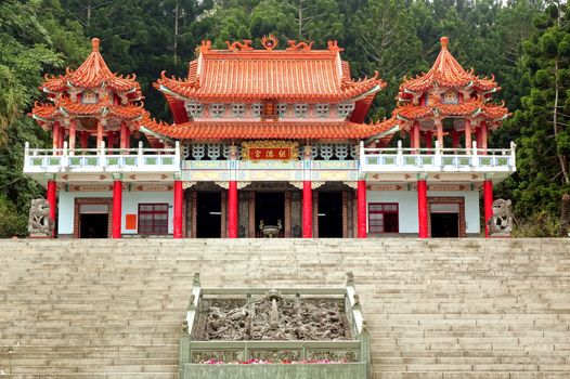 KAOHSIUNG, TAIWAN -- JANUARY 30, 2015:  The traditional Gong De Temple in the foothills of Liu-Yi Mountain is surrounded by dense forests.
