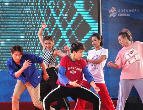 KAOHSIUNG, TAIWAN -- JUNE 30, 2018: Young people perform a hip-hop dance at the opening of the Love River Festival, a free, public outdoor event.