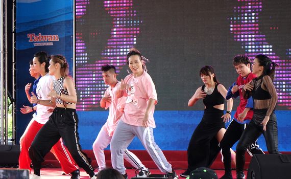 KAOHSIUNG, TAIWAN -- JUNE 30, 2018: Young people perform a hip-hop dance at the opening of the Love River Festival, a free, public outdoor event.