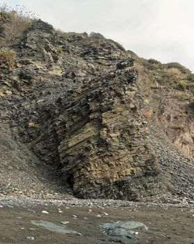 Image of a section of the cliffs/ rocks at Carylon Bay on the Coast of Cornwall, UK.